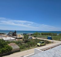 A seaside scene with a view of the calm blue waters in the town of Privlaka.