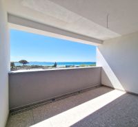 A view from the balcony of a 3-room apartment to the coast in Privlaka.