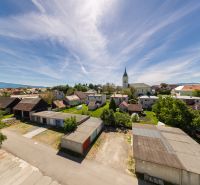 Scenery in Očová with a view of the rooftops and the church.