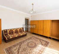 Living room with carpet and furniture, wooden decor flooring in a family house.