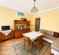 Living room in a family house with carpet and furniture, floor with wood decor.