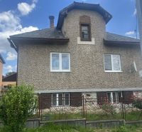 A family house in Rudná with a garden and a tiled roof.