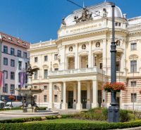 The historical building of the Slovak National Theatre on Hviezdoslav Square in Bratislava with greenery.