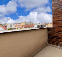 The balcony of a 2-room apartment with a view of the rooftops in the Old Town of Bratislava.