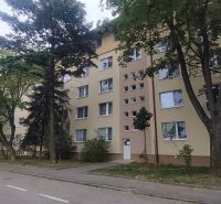 Apartment building on Exnárova Street in Bratislava - Ružinov surrounded by trees.