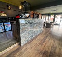 Commercial premises with a stylish interior, wood-patterned flooring, modern design.