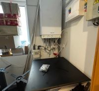 Interior of commercial premises with a workbench and tools in the room.