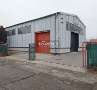 Industrial building with a metal roof and entrance gates in KE - Džungľa, offices.