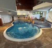 In hotels and guesthouses, there is an indoor pool with mosaic tiles and seating.
