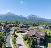 A picturesque view of the mountain environment and hotels and guesthouses in Nová Lesná.