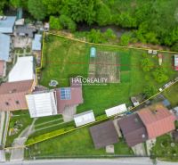 Aerial view of a family house in Dolná Mariková with a garden and solar panels.
