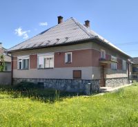A family house on Štúrova Street in Sučany with a lawn and a metal roof.
