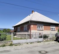 A family house on Štúrova Street in Sučany, with a large yard and a car in front.