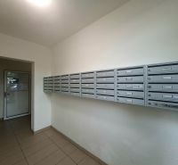 Mailboxes in the entrance hall of the studio apartment, tiled floor, simple design.