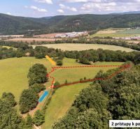 Recreational plots in Ostrá Lúka with access roads surrounded by nature and hills.