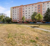 An apartment building surrounded by a playground on Československých Parašutistov Street, Bratislava - Nové Mesto.