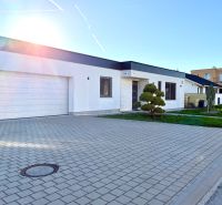 Family house on Lipová Street in Pata with a garage and a landscaped front garden.