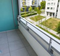 Balcony of a 1-room apartment with a view of greenery on Hraničná Street, Bratislava - Ružinov.