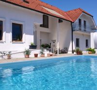 A family house in Žabokreky near Žabokreky Street, a pool in the yard, sunny weather.