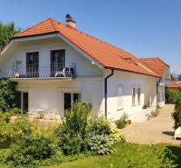 A family house in Žabokreky on Žabokreká Street with a red roof and a garden.