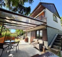 A cottage on Kunov Street in Senica with outdoor seating and garden furniture.