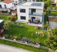 A family house in Martin with a beautiful garden, terrace, and solar panels on the roof.