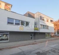 Commercial premises in Senica, a modern building with glass displays on the pedestrian zone.