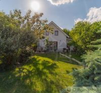 A family house in Bernolákovo surrounded by a lush garden on a sunny plot.