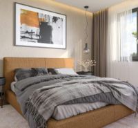 A modern bedroom in a family house with a comfortable box spring bed and decorative elements.