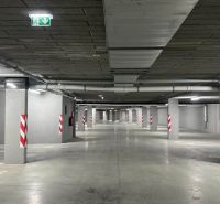 Underground parking in the Recreation Apartment in Tále, Horná Lehota, with designated parking spaces.