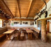 Rustic dining room with wooden decor in hotels and guesthouses, hunting-themed decorations.