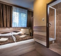 Comfortable room with a bed, carpet, bathroom in hotels and guesthouses.