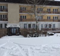 Hotel and guesthouse in Liptovský Ján with a snow-covered roof and exterior.
