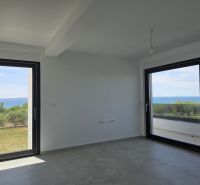 A bright space in a 4-room apartment with large windows and a view of the sea.