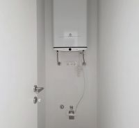 A boiler located in a white wall in a 4-room apartment.