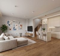 Living room with kitchen in a family house, wooden decor flooring, light furniture.