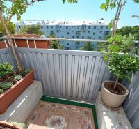 Balcony of a 2-room apartment with plants on Kyjevská Street, Bratislava - Nové Mesto.