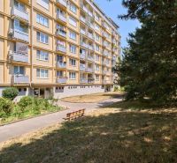 Apartment building on Kyjevska Street in Bratislava - Nové Mesto, surrounded by greenery and trees.