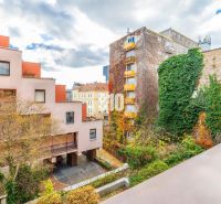 View of Grösslingova Street in Bratislava-Old Town with greenery and colorful buildings.