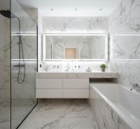 Luxury bathroom with a shower, bathtub, and large mirror in a 4-room apartment.