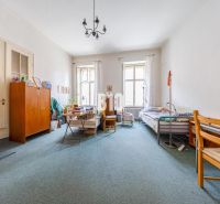 A spacious room with two beds and a carpet in a 2-room apartment.