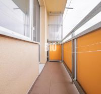 Balcony of a 3-room apartment on Ďumbierska Street in Nitra with orange railings.