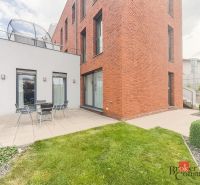 Modern terrace with outdoor seating by a brick house on Bárdošova Street, Bratislava-Nové Mesto.