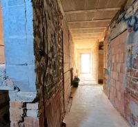 An interior in an unfinished state with brick walls in a family house.