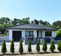 A family house in Šajdíkovce Humence, with a garage and a landscaped garden.