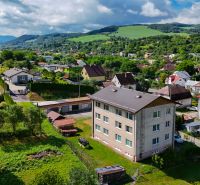 Homes and nature in Dohňany. A building housing a 3-room apartment is visible from the outside.