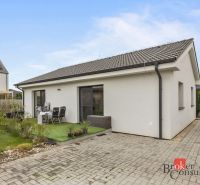 A family house in Bratislava-Podunajské Biskupice with a terrace, garden, and paved walkway.