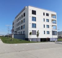Apartment building on Tulipánová Street in Sereď with four floors and a parking lot.