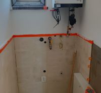 Room with a window and a boiler in a family house.