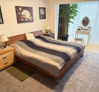 Bedroom with a bed, carpets, and decorations, Family house.